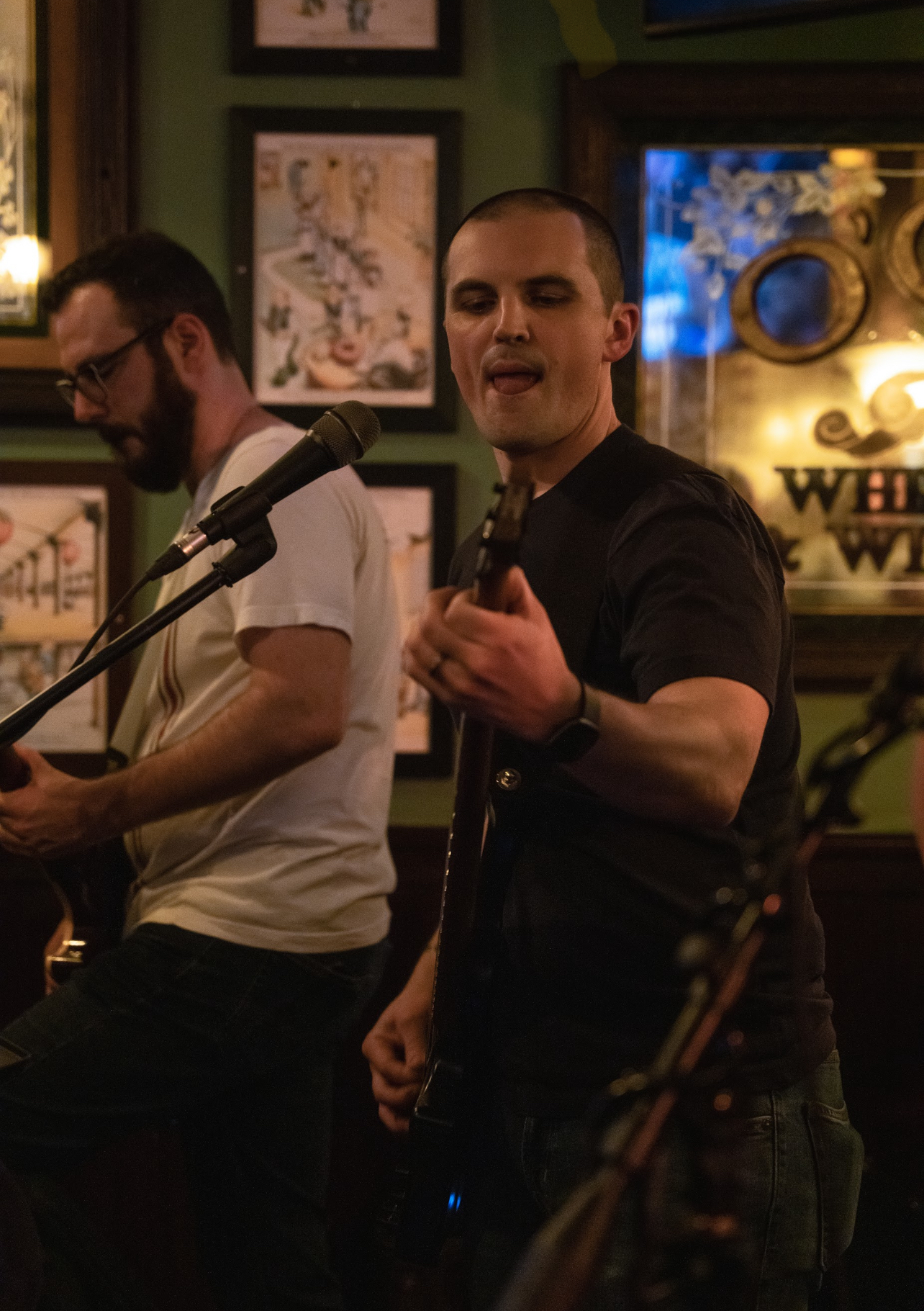 Jon, the bassist of Party Fowl, performs in Plymouth, Michigan