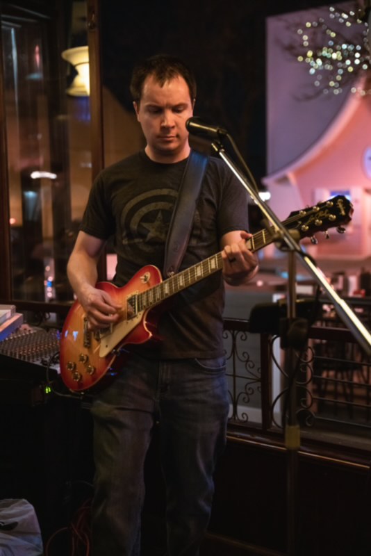 Rick, guitarist, vocalist, and keyboardist for Party Fowl, performs in Plymouth, Michigan