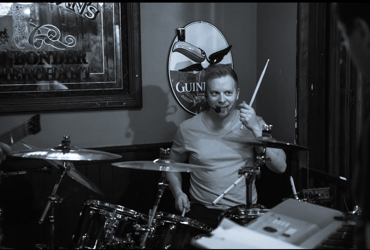 Shawn, the drummer of Party Fowl, performs in Plymouth, Michigan